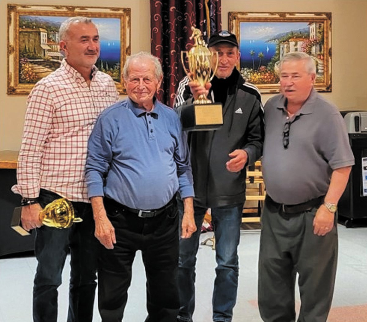 OCEAN STATE BOCCI LEADERS: The night’s big bocce trophy was for the Rhode Island statewide winners. The Terminators from the Prata Society, managed by Gaetano Cozzi, also included players Raffaele Laurenza, Gaetano Babelli, Angelo Riccio, and Frank DiLanna. (Photo courtesy Louis Spremulli)